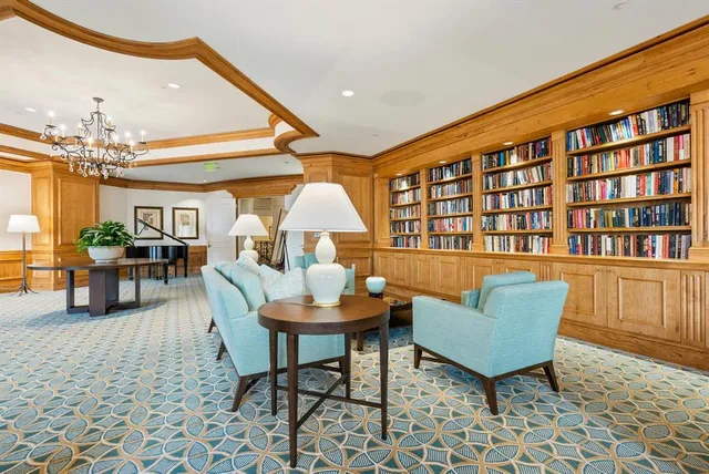 a view of a swimming pool with an outdoor space and seating area