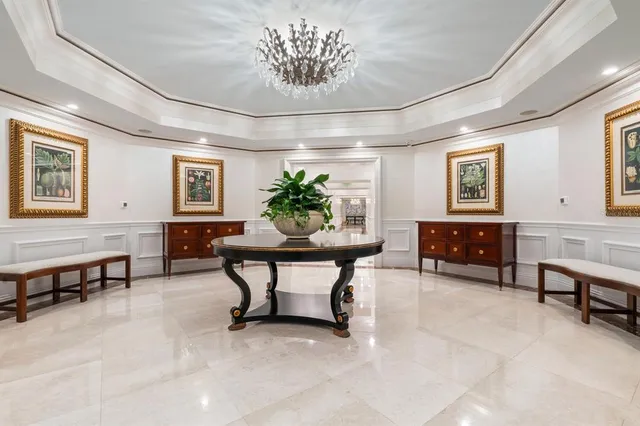 a view of a livingroom with furniture a fireplace and wooden floor