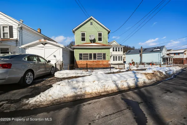 a view of multiple houses with a yard