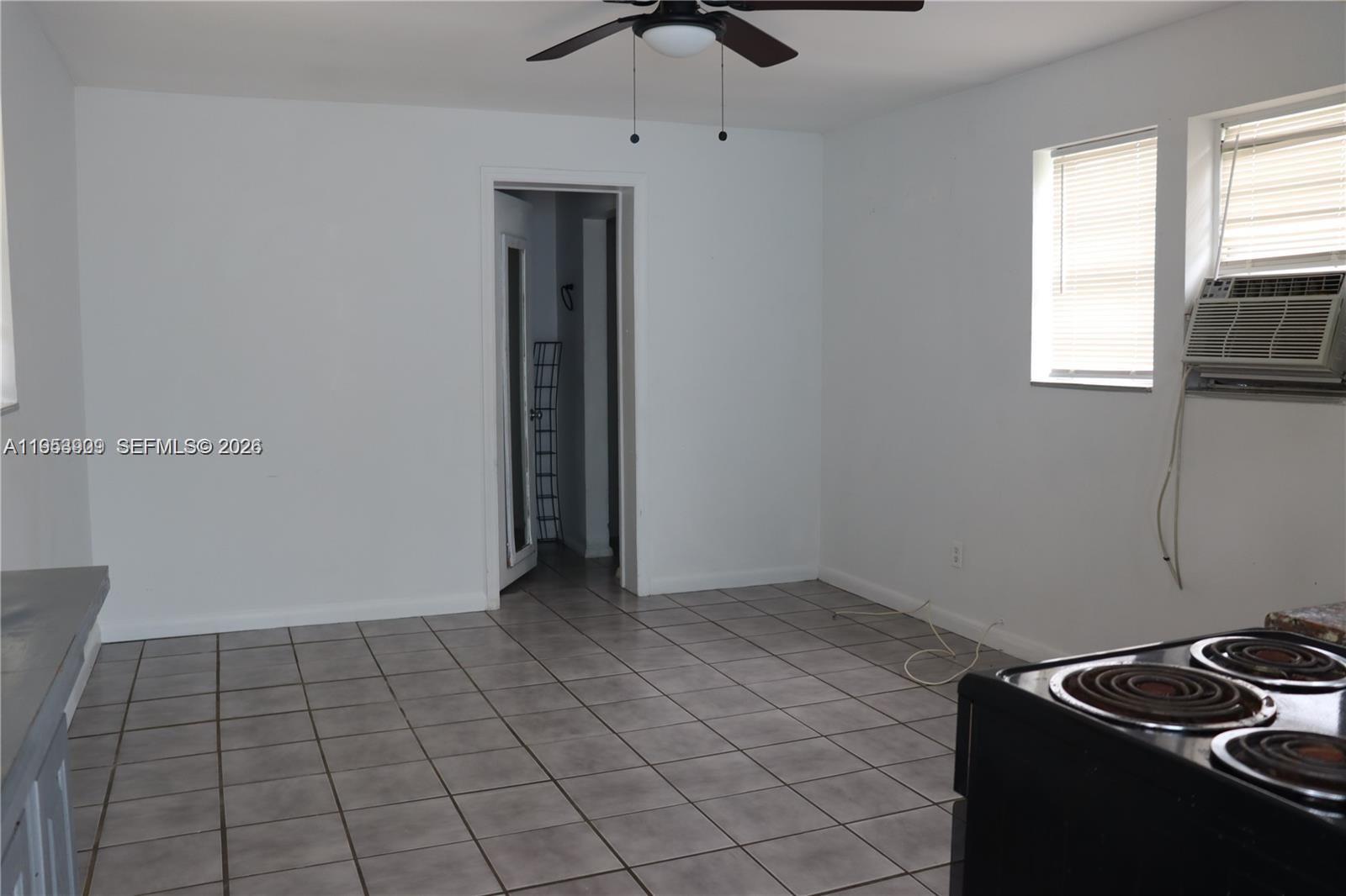 5743 Lincoln Street, Unit 2 Hollywood, FL 33021 - Photo 3 of 5 a view of an empty room with a window