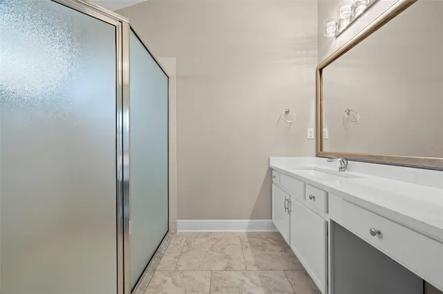 a bathroom with a double vanity sink and mirror