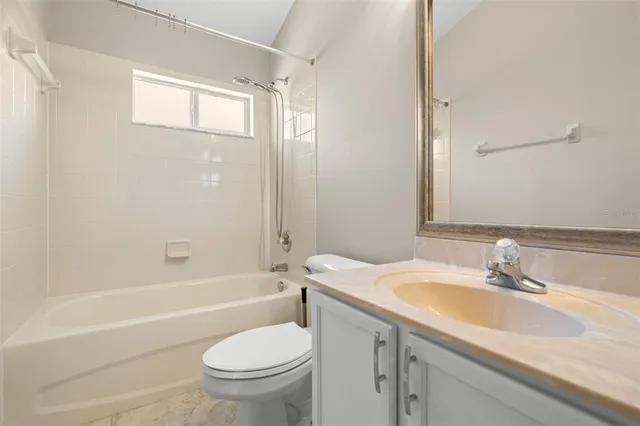 a bathroom with a sink a toilet and a bathtub