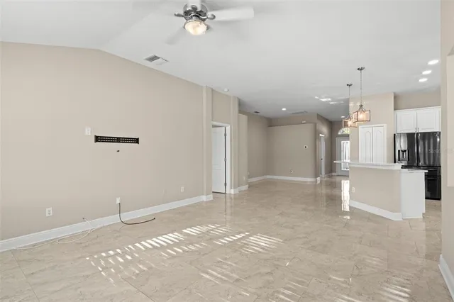 a view of a kitchen with a sink and cabinets