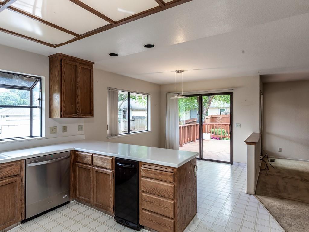 22762 Alcalde Road Cupertino, CA 95014 - Photo 4 of 7 a kitchen with a sink stove and cabinets
