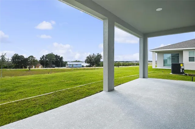 a view of a house with a big yard
