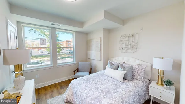 a bedroom with a bed and a window