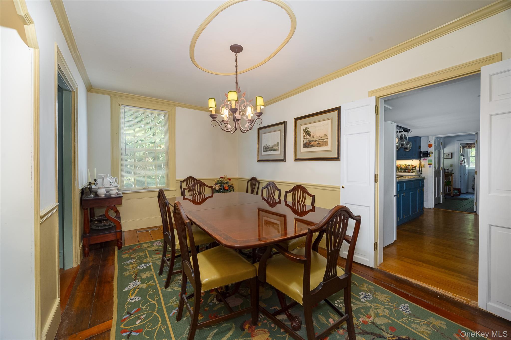 212 Pleasant Ridge Road Poughquag, NY 12570 - Photo 15 of 43 Dining room featuring hardwood flooring, a ceiling medallion, and a multi-light chandelier