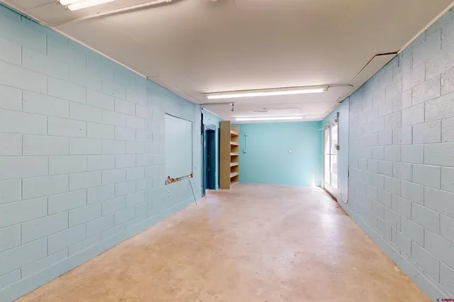 a view of a chairs and table in the patio