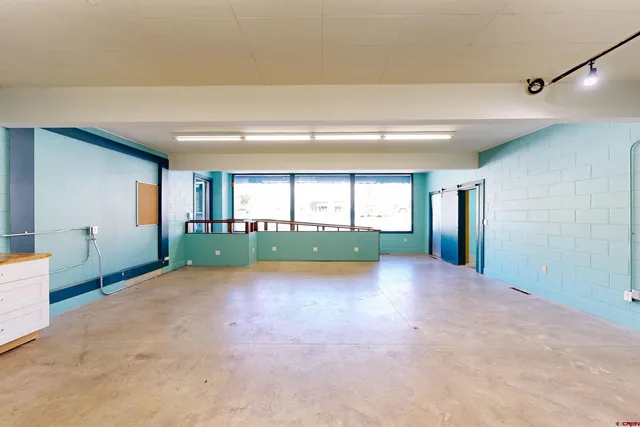 a bathroom with a toilet and a bath tub