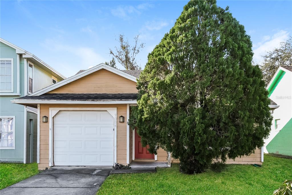 9304 Daney Street Gotha, FL 34734 - Photo 1 of 1 a front view of a house with a yard