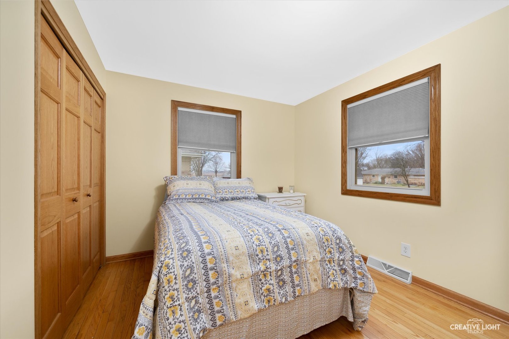 131 Terry Drive Sugar Grove, IL 60554 - Photo 12 of 27 a bedroom with a bed and a painting on the wall