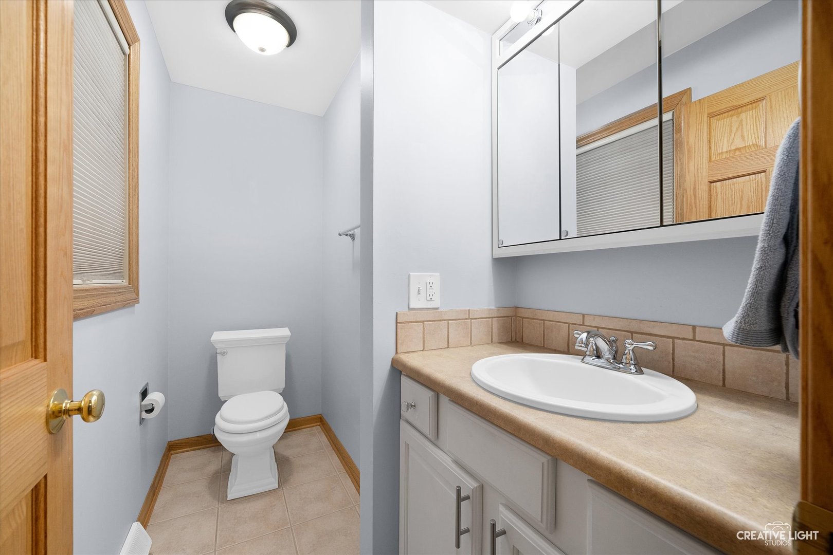 131 Terry Drive Sugar Grove, IL 60554 - Photo 14 of 27 a bathroom with a sink a toilet and a mirror