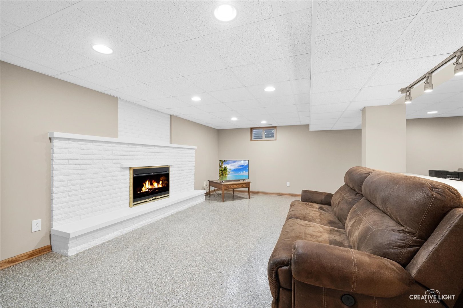 131 Terry Drive Sugar Grove, IL 60554 - Photo 18 of 27 a living room with furniture and a fireplace