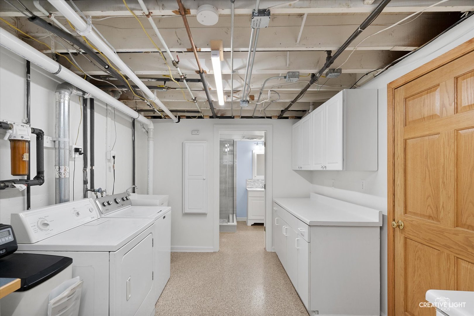 131 Terry Drive Sugar Grove, IL 60554 - Photo 23 of 27 a bathroom with a sink and a mirror