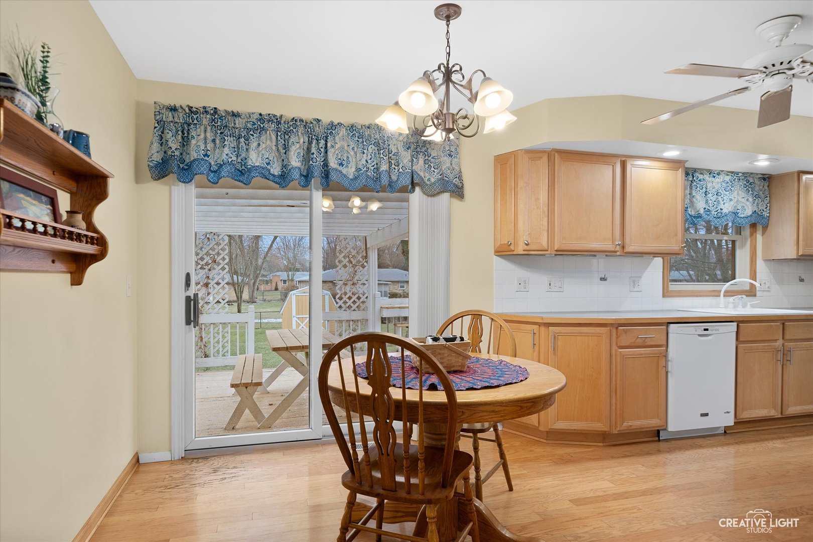 131 Terry Drive Sugar Grove, IL 60554 - Photo 7 of 27 a view of a dining room with furniture a chandelier and wooden floor