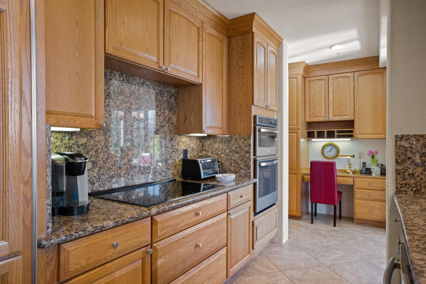 12365 Saddle Road Carmel Valley, CA 93924 - Photo 16 of 65 a kitchen with stainless steel appliances granite countertop a refrigerator and a sink