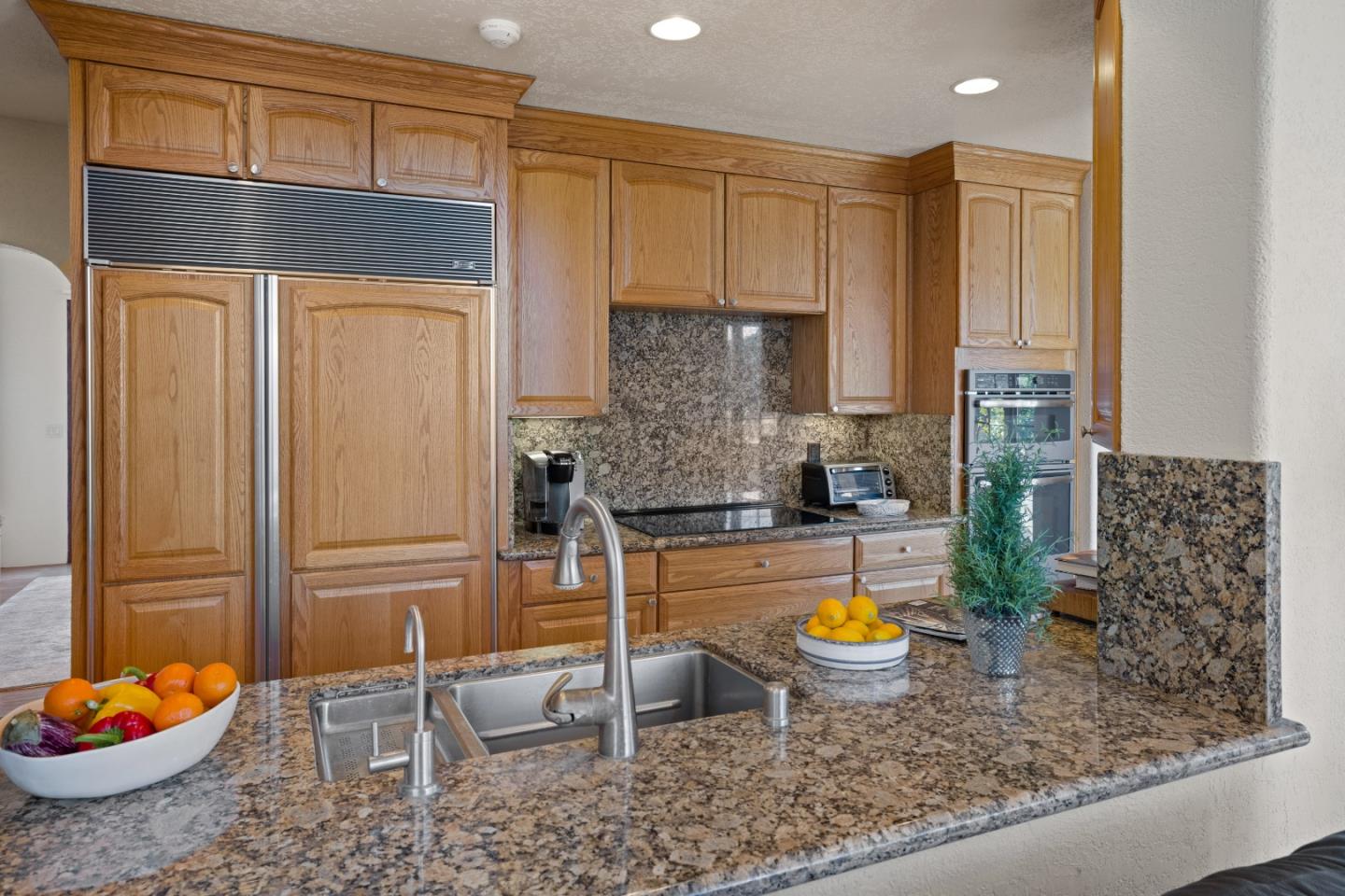 12365 Saddle Road Carmel Valley, CA 93924 - Photo 17 of 65 a kitchen with a sink and a refrigerator