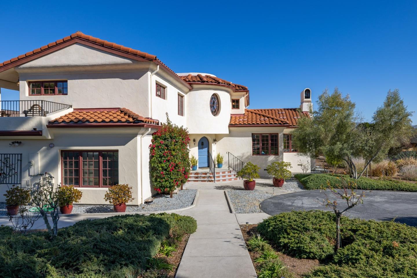 12365 Saddle Road Carmel Valley, CA 93924 - Photo 2 of 65 a front view of a house with garden