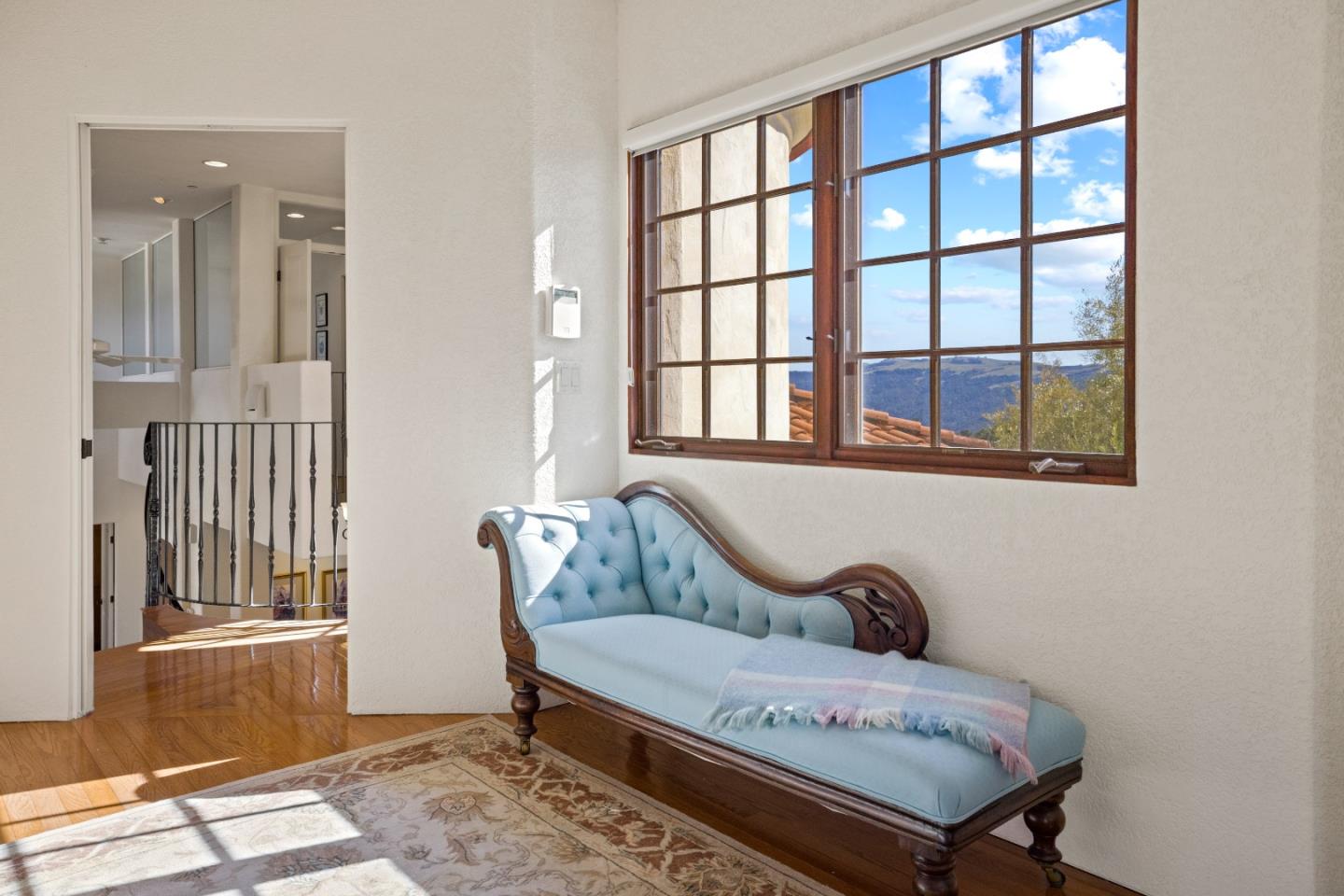 12365 Saddle Road Carmel Valley, CA 93924 - Photo 24 of 65 a bedroom with a bed and wooden floor