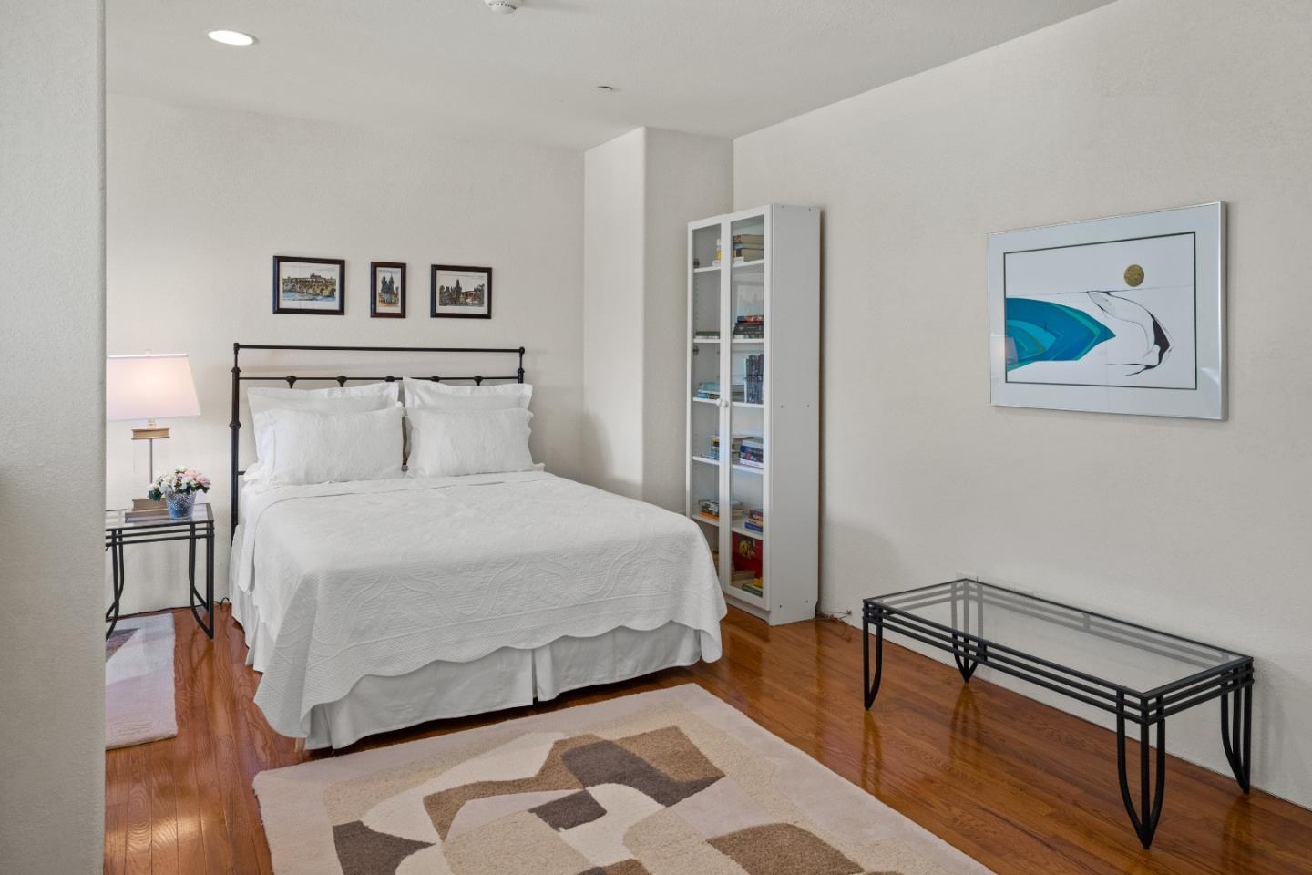 12365 Saddle Road Carmel Valley, CA 93924 - Photo 29 of 65 a bedroom with a bed and a lamp on dresser