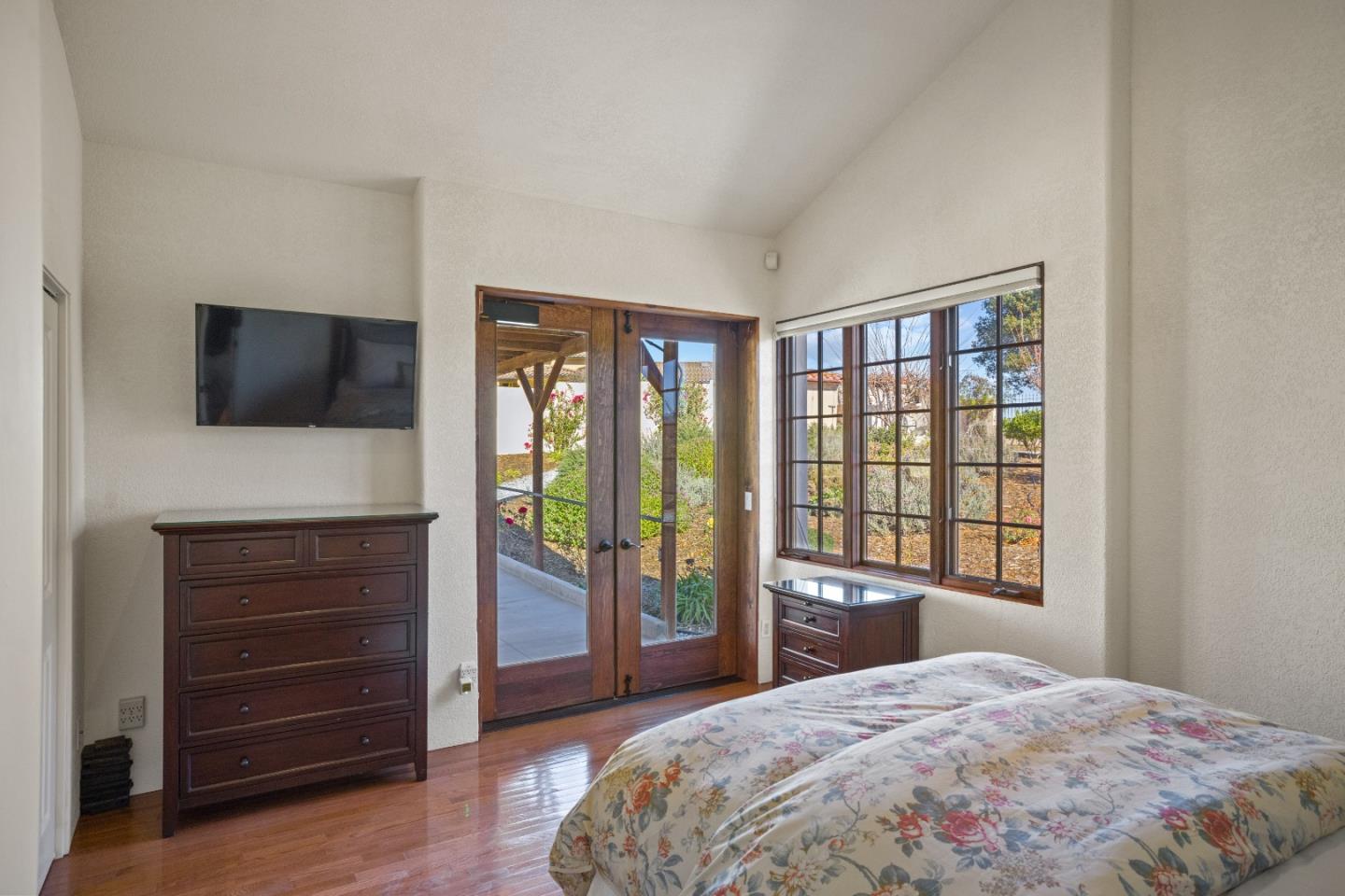 12365 Saddle Road Carmel Valley, CA 93924 - Photo 37 of 65 a bedroom with a bed and a television
