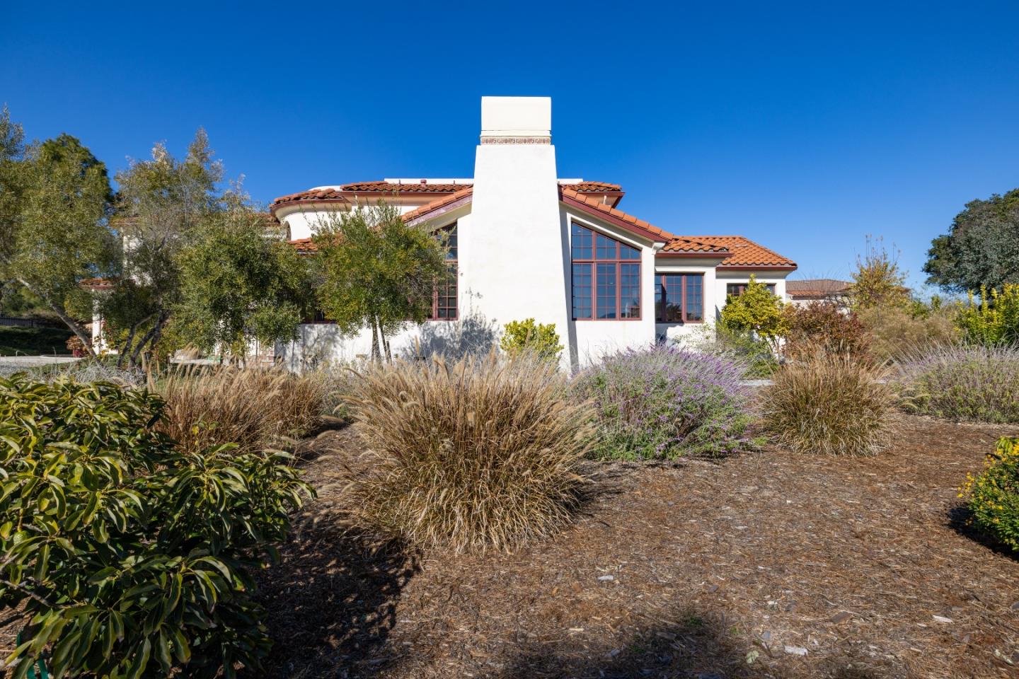 12365 Saddle Road Carmel Valley, CA 93924 - Photo 58 of 65 a front view of a house with a yard