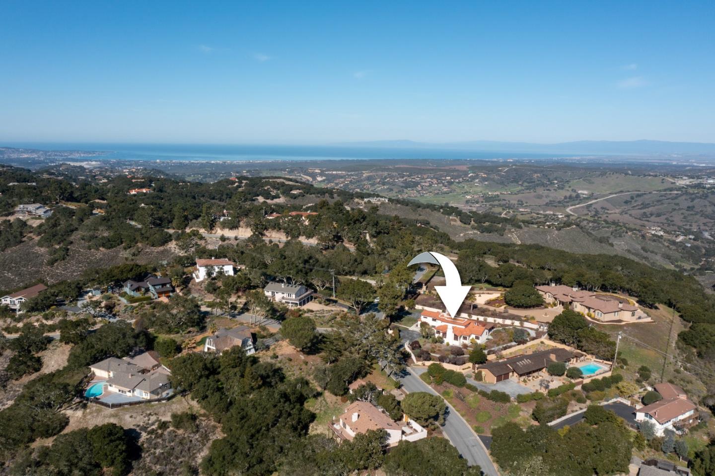 12365 Saddle Road Carmel Valley, CA 93924 - Photo 65 of 65 an aerial view of a house with a ocean view