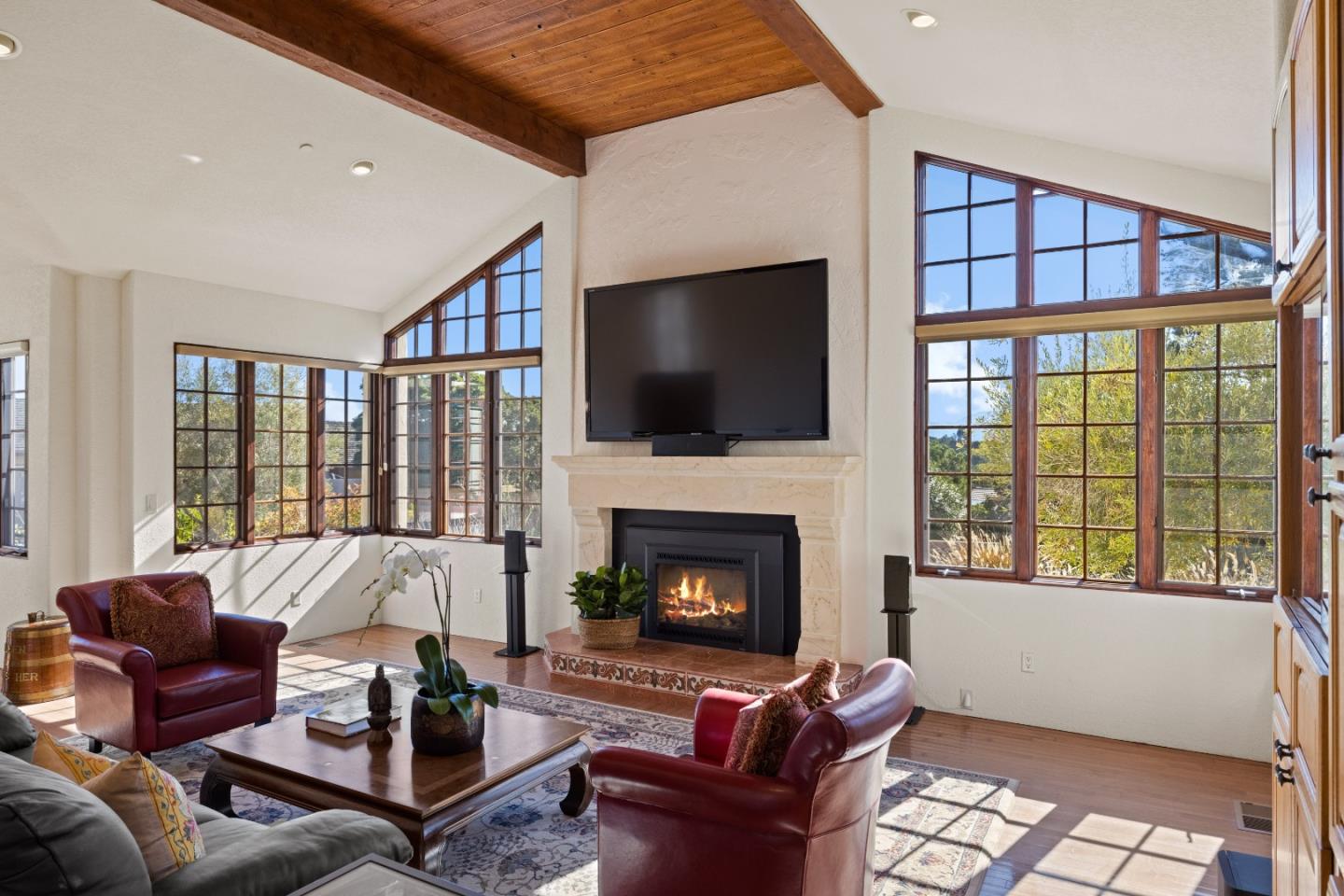 12365 Saddle Road Carmel Valley, CA 93924 - Photo 7 of 65 a living room with furniture fireplace and a flat screen tv