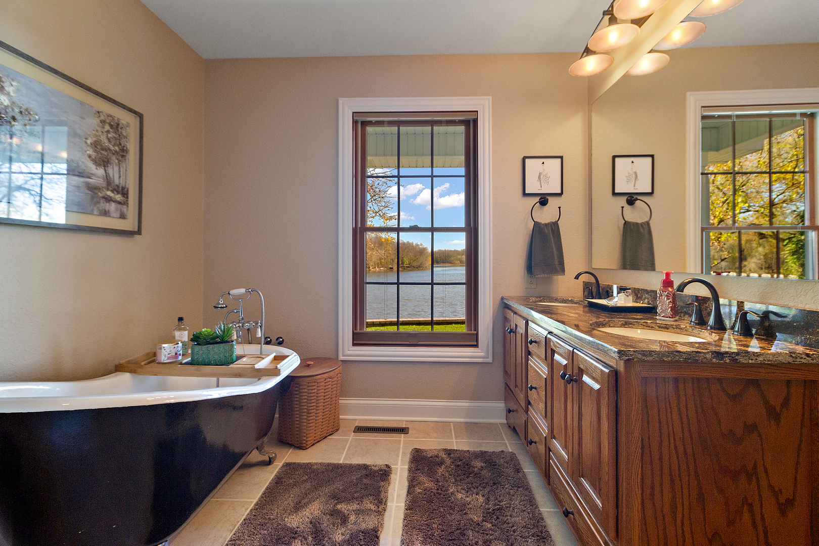 3157 River Road Kankakee, IL 60901 - Photo 17 of 50 a bathroom with a double vanity sink a mirror and a bathtub
