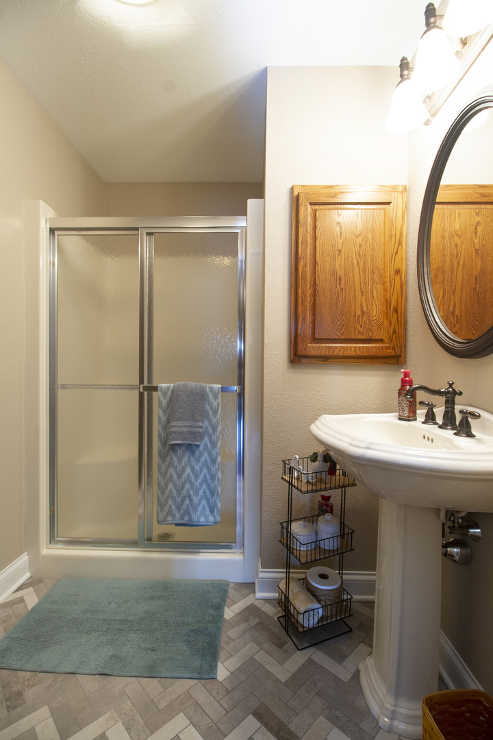 3157 River Road Kankakee, IL 60901 - Photo 23 of 50 a bathroom with a sink and a mirror