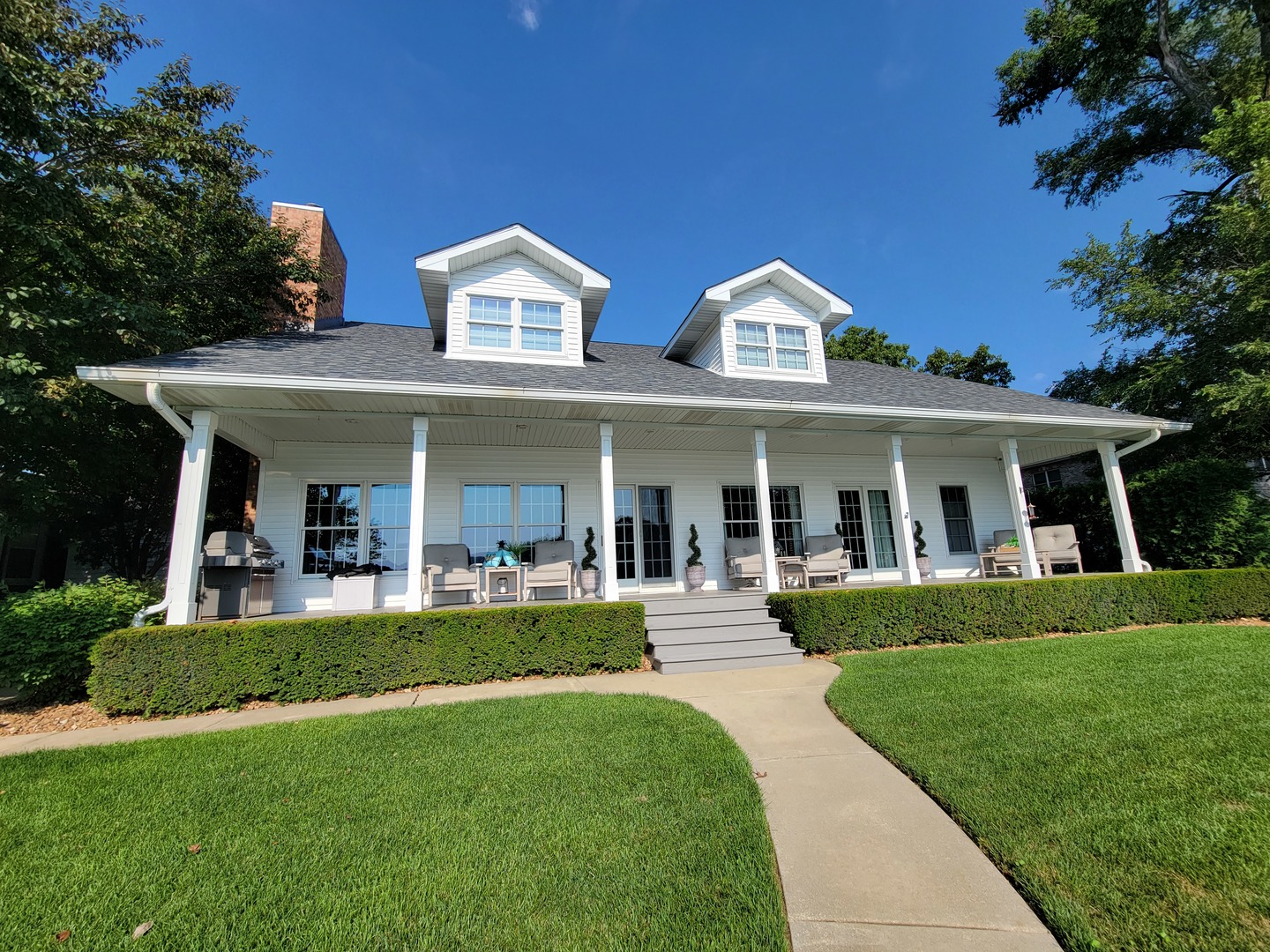 3157 River Road Kankakee, IL 60901 - Photo 37 of 50 a front view of a house with a yard table and chairs