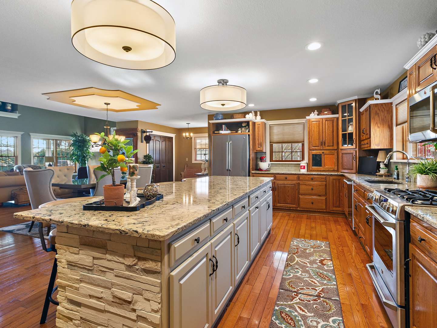 3157 River Road Kankakee, IL 60901 - Photo 9 of 50 a kitchen with stainless steel appliances granite countertop a stove a sink and a refrigerator