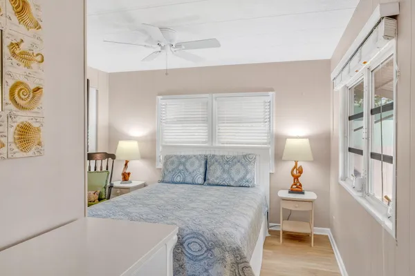 a bedroom with a bed and a table in it