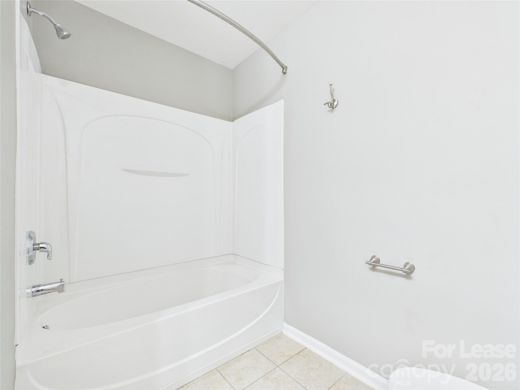 5690 Stafford Road Charlotte, NC 28215 - Photo 21 of 25 a bathroom with a bathtub