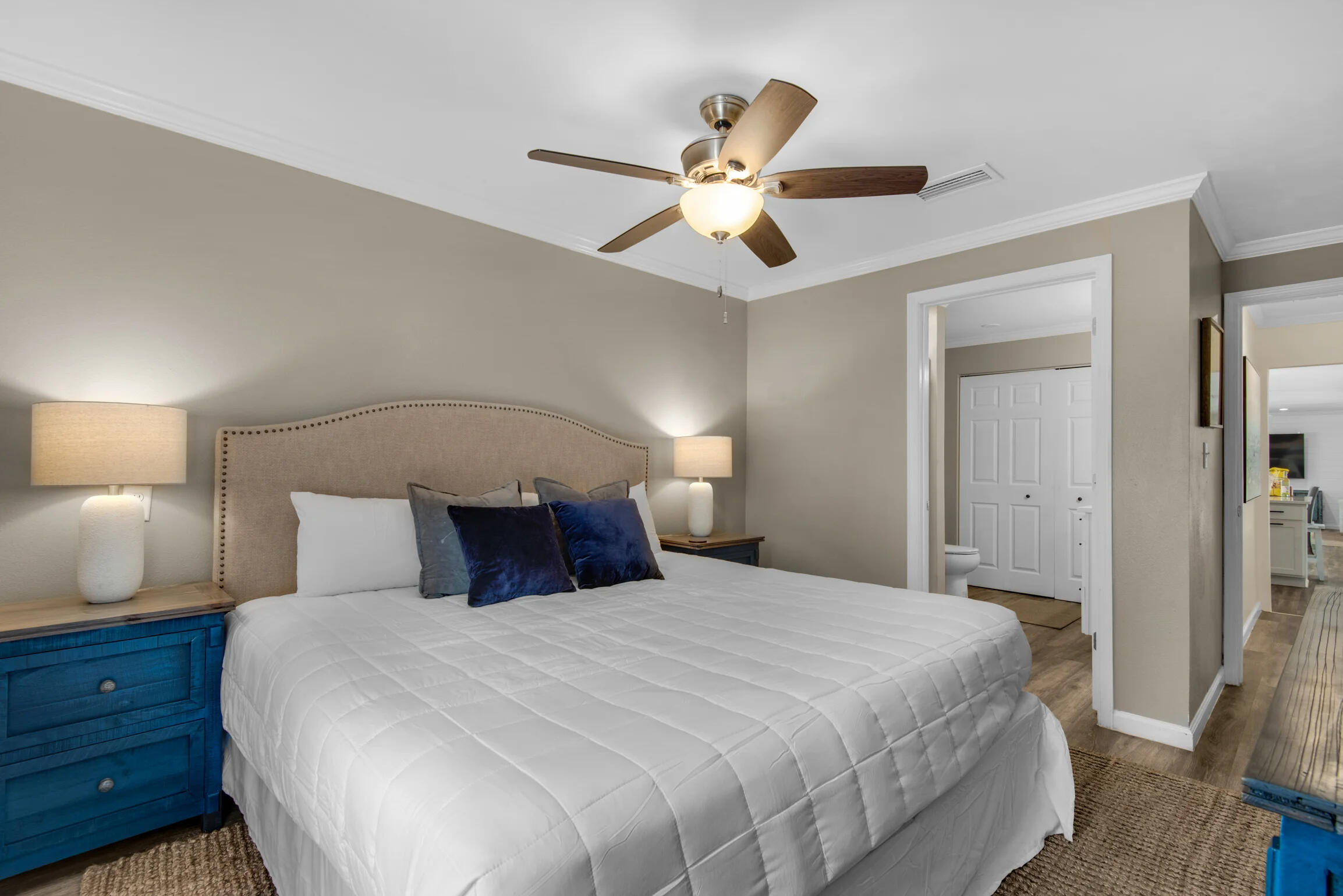 58 Overlook Drive Destin, FL 32550 - Photo 15 of 48 a bedroom with a large bed and a chandelier