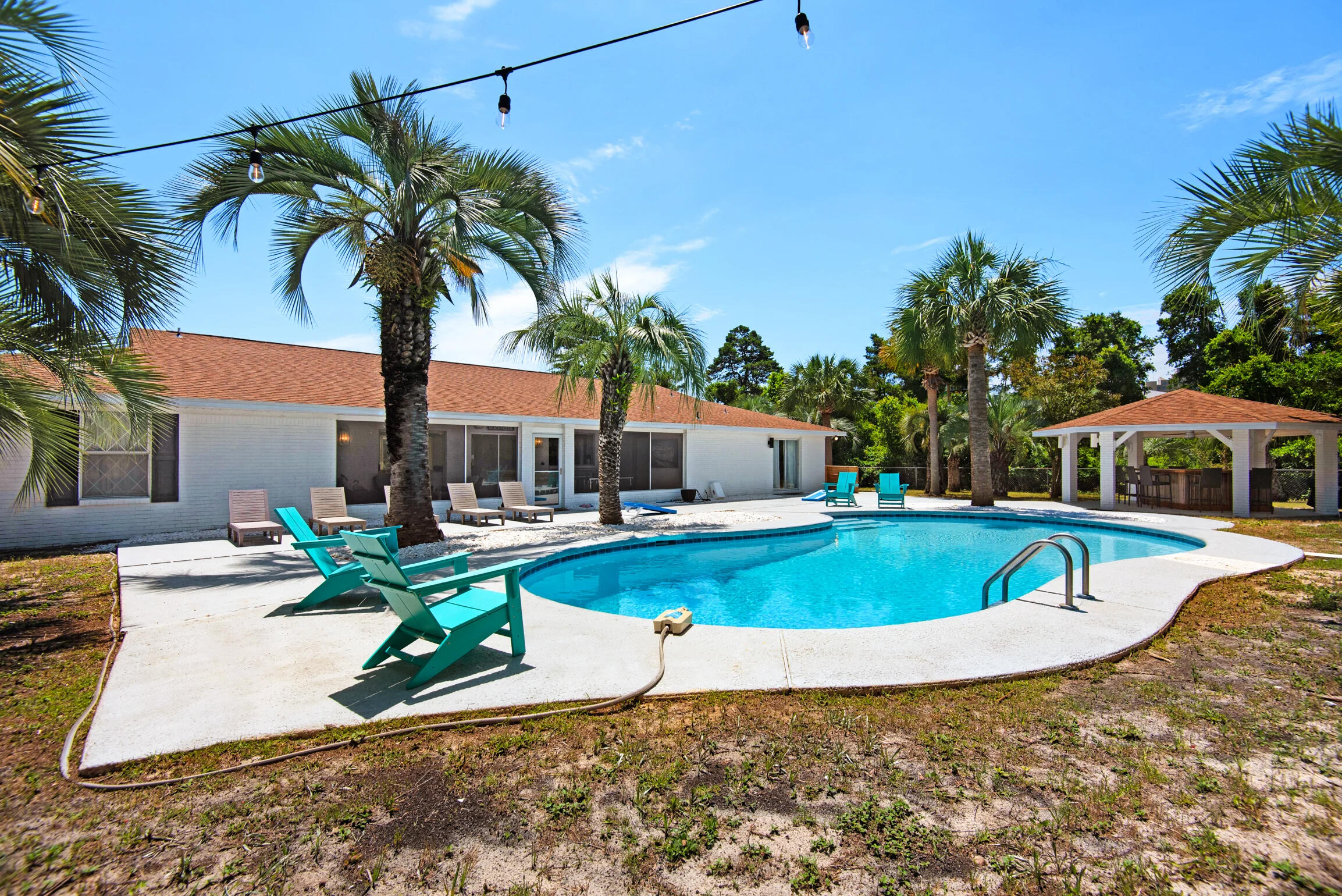 58 Overlook Drive Destin, FL 32550 - Photo 38 of 48 a view of a swimming pool with a patio and a garden