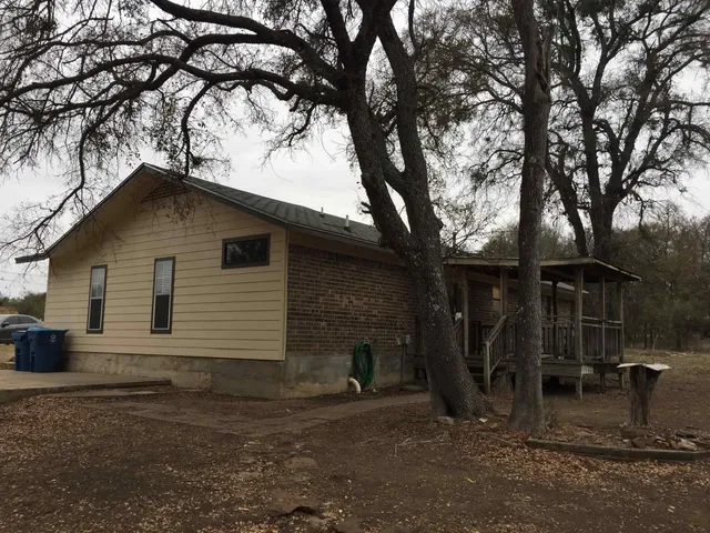a house with trees in front of it