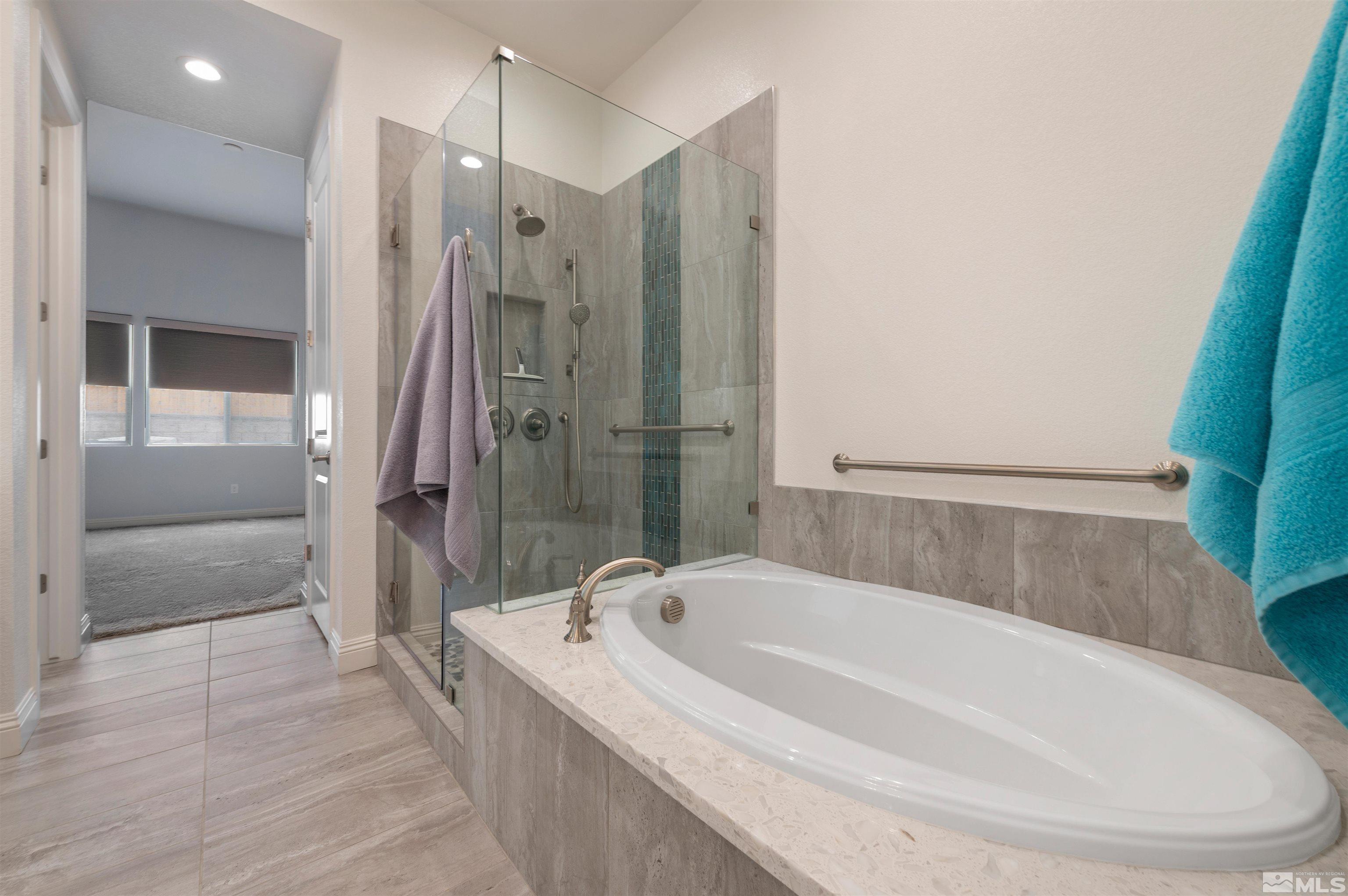 9404 Flying Horse Road Reno, NV 89521 - Photo 24 of 40 a spacious bathroom with a bathtub and a shower