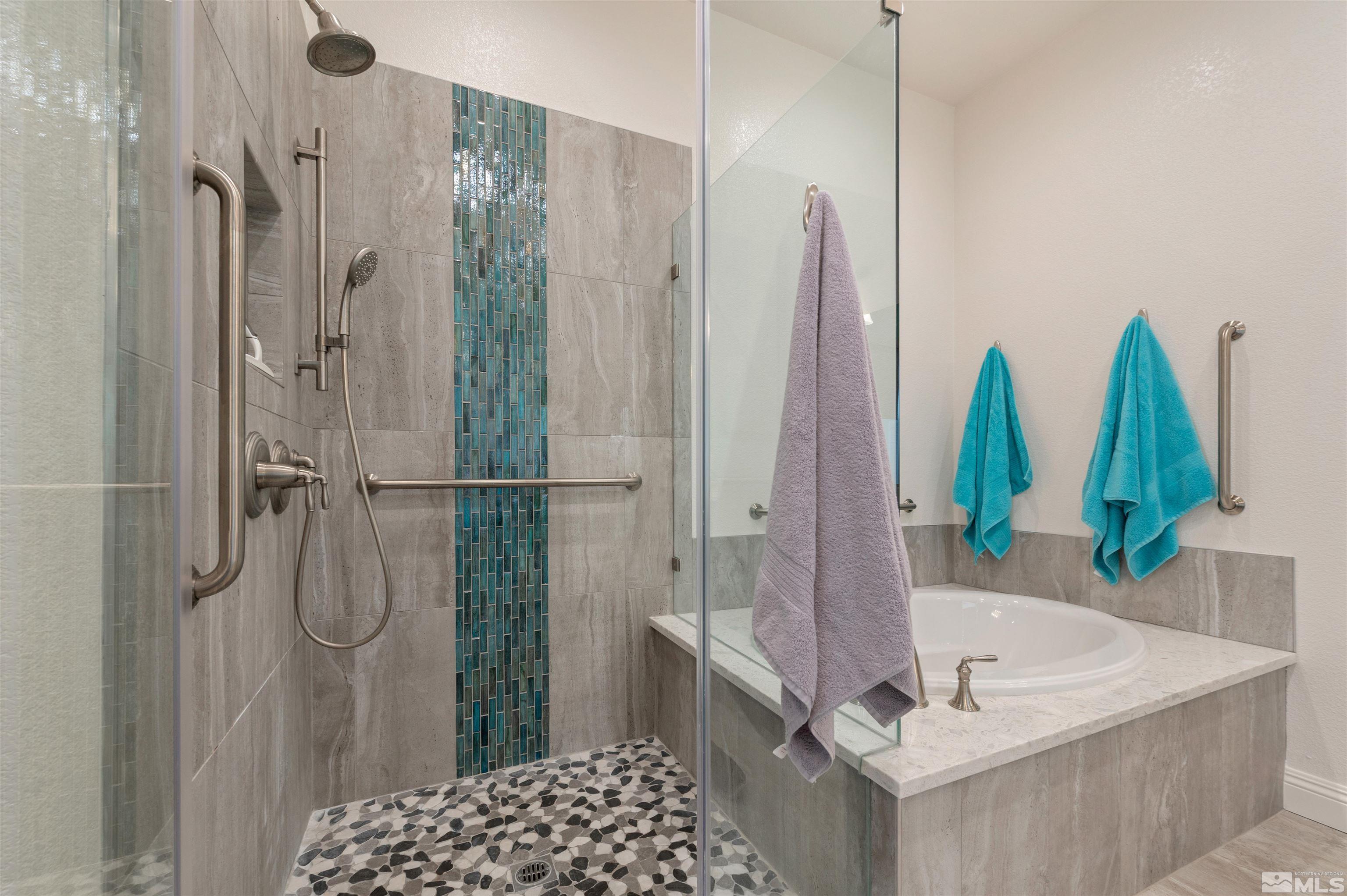 9404 Flying Horse Road Reno, NV 89521 - Photo 25 of 40 a bathroom with a tub sink and shower