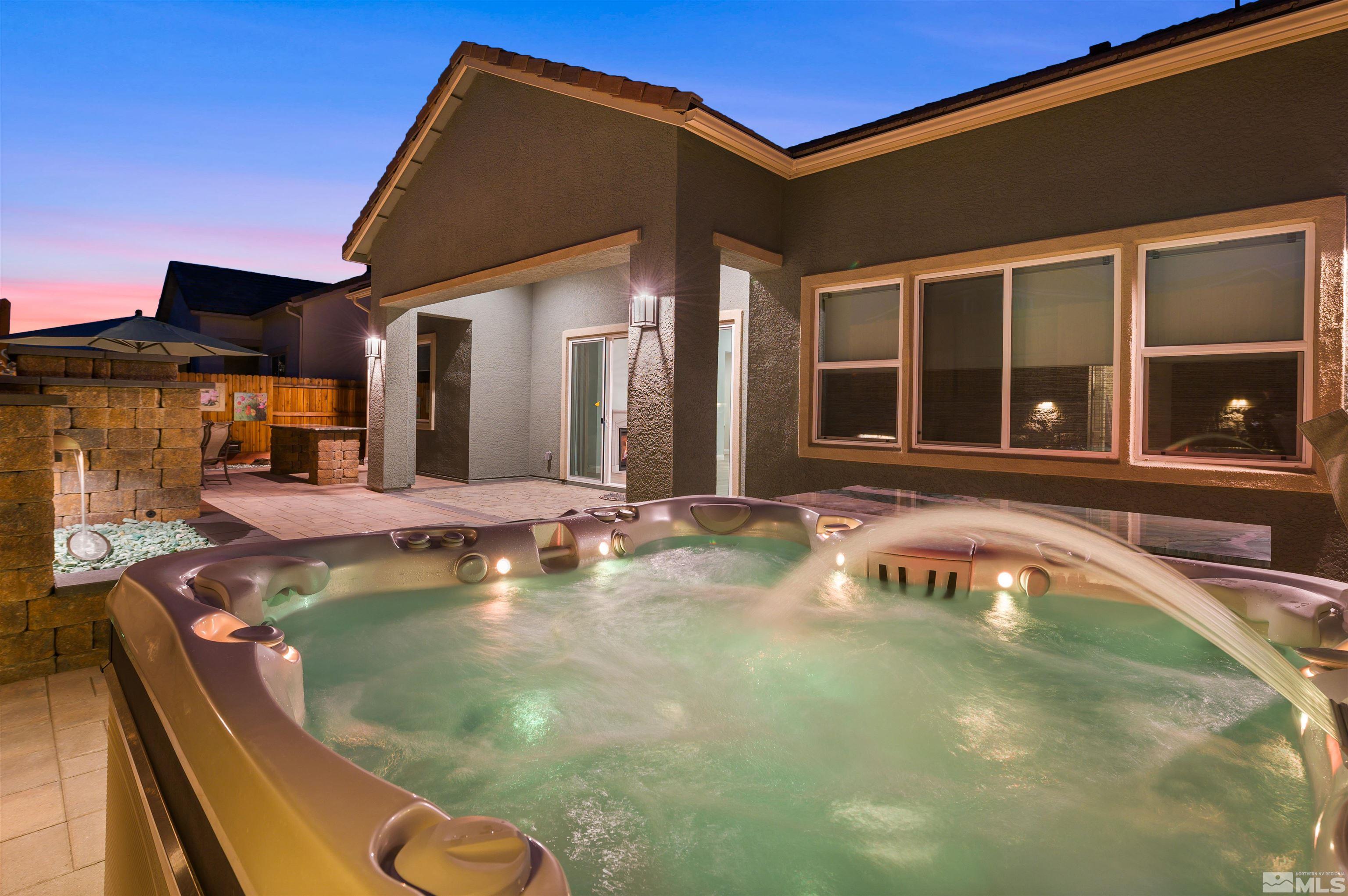 9404 Flying Horse Road Reno, NV 89521 - Photo 4 of 40 a view of a house with swimming pool and sitting area