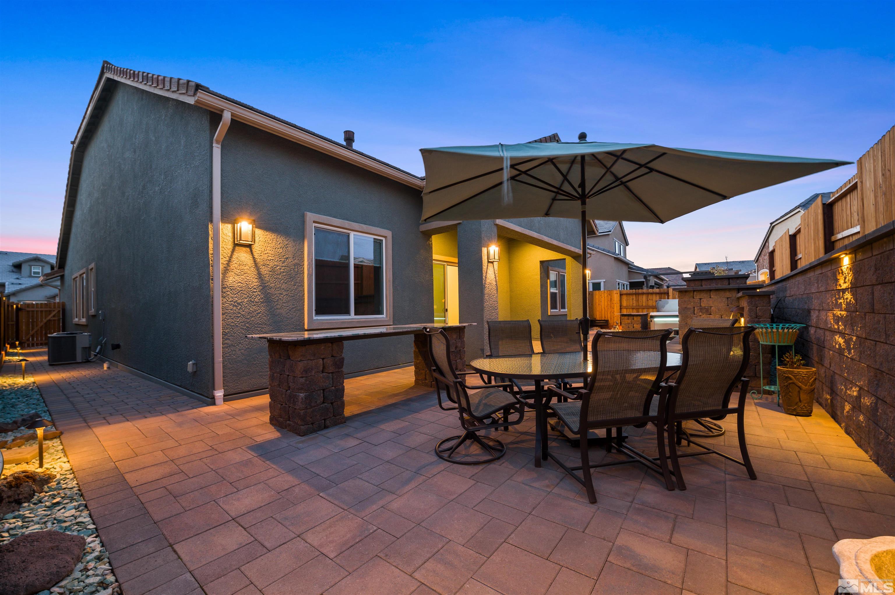 9404 Flying Horse Road Reno, NV 89521 - Photo 7 of 40 a view of a dinning table and chairs in the patio