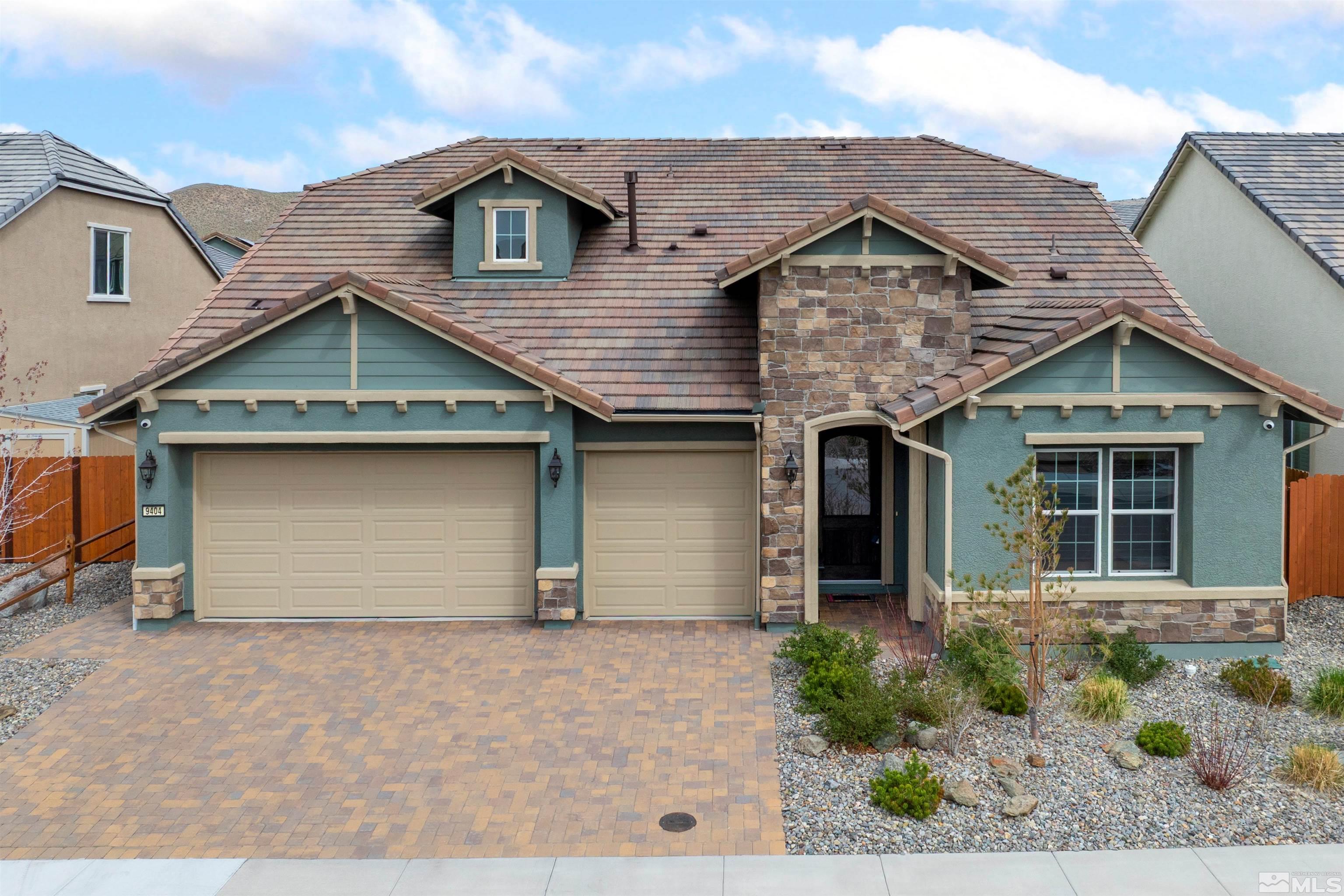 9404 Flying Horse Road Reno, NV 89521 - Photo 10 of 40 a front view of a house with garden