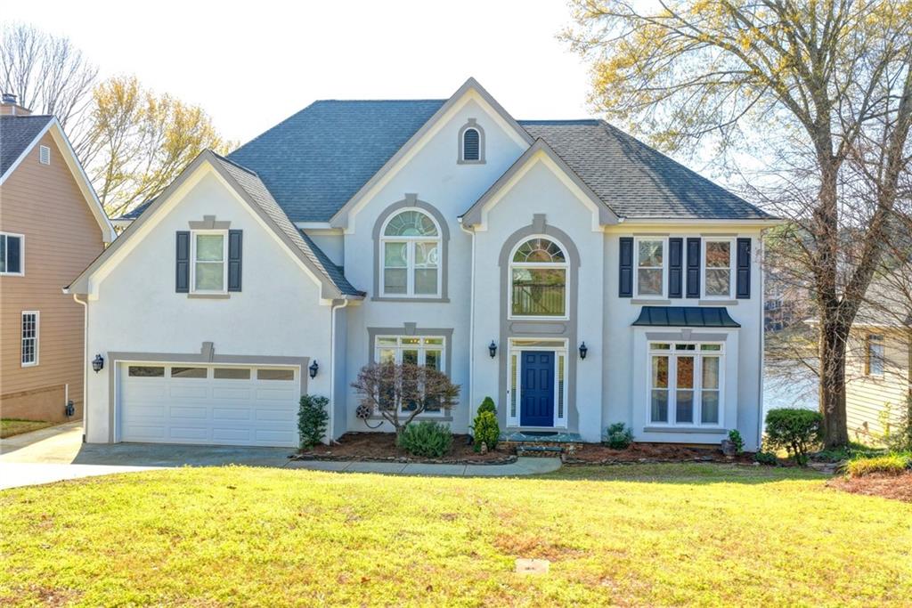 2152 Merrymount Drive Suwanee, GA 30024 - Photo 1 of 63 a front view of a house with a yard