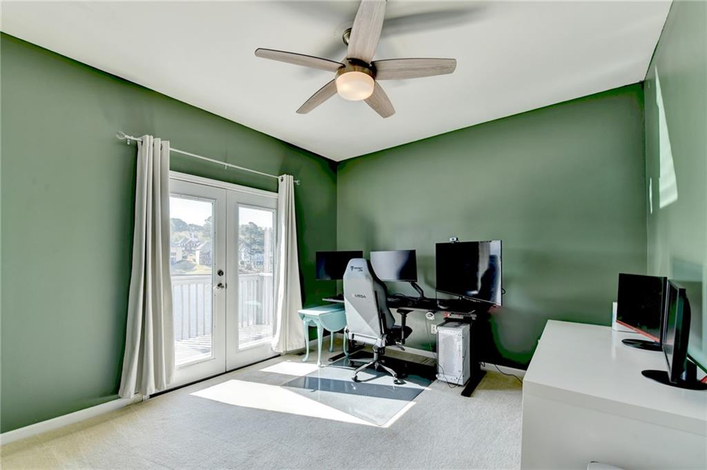 2152 Merrymount Drive Suwanee, GA 30024 - Photo 16 of 63 a view of a workspace with furniture and a window