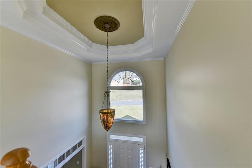 2152 Merrymount Drive Suwanee, GA 30024 - Photo 19 of 63 a view of a hallway with a chandelier