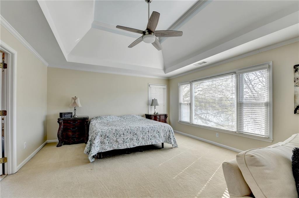 2152 Merrymount Drive Suwanee, GA 30024 - Photo 20 of 63 a bedroom with a bed and a couch