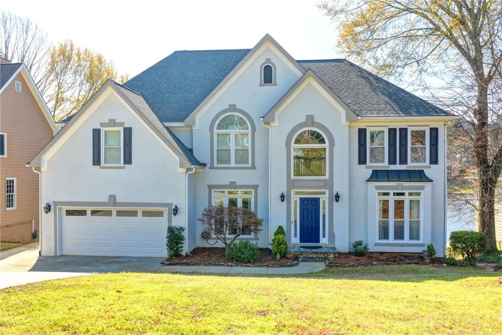 2152 Merrymount Drive Suwanee, GA 30024 - Photo 2 of 63 a front view of a house with a yard