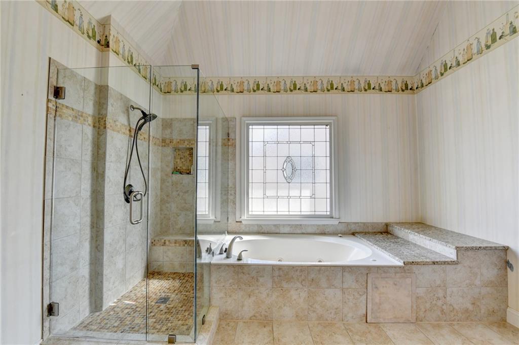 2152 Merrymount Drive Suwanee, GA 30024 - Photo 25 of 63 a view of an empty room with a glass door shower