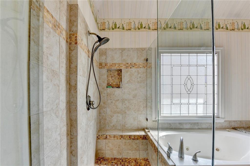 2152 Merrymount Drive Suwanee, GA 30024 - Photo 27 of 63 a bathroom with a granite countertop shower