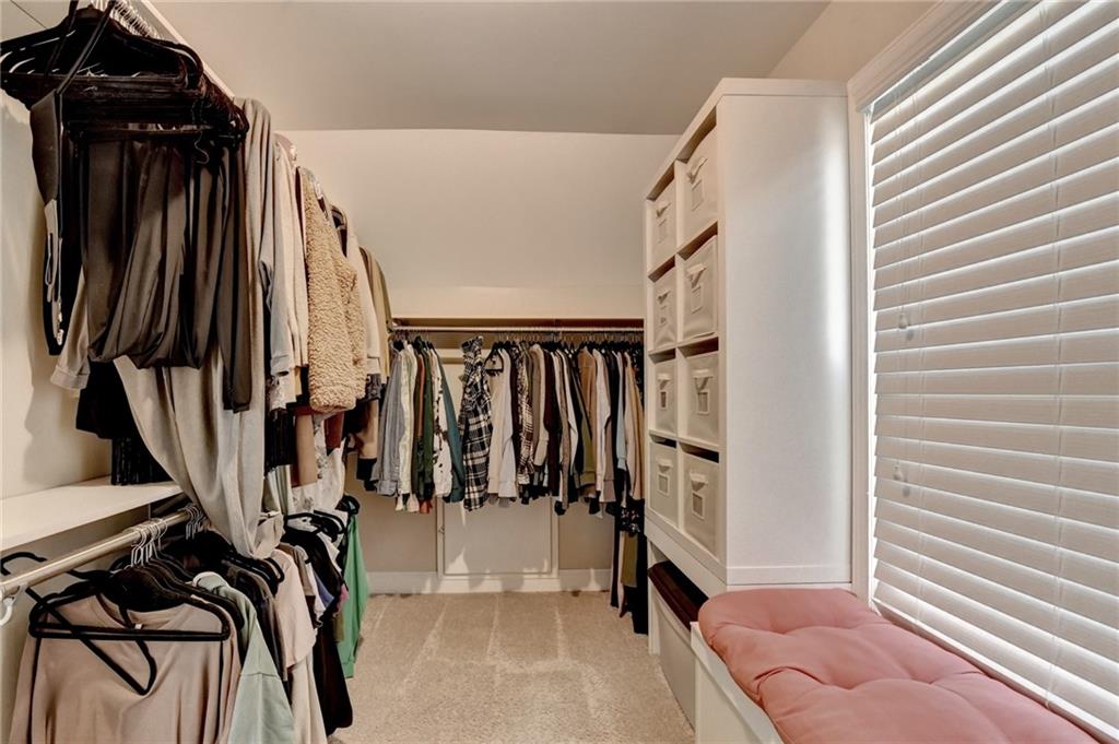2152 Merrymount Drive Suwanee, GA 30024 - Photo 29 of 63 a view of walk in closet with clothes and shoes